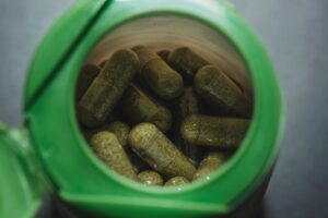 Green pills in a container